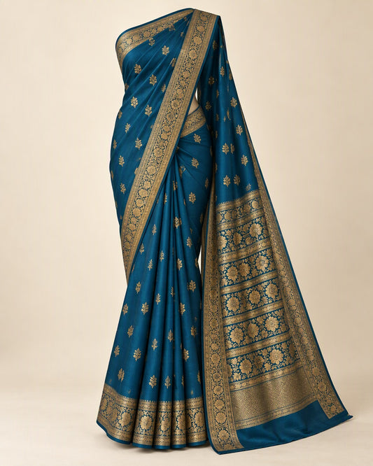 Peacock blue saree with small gold floral motifs and a deep gold border, front view