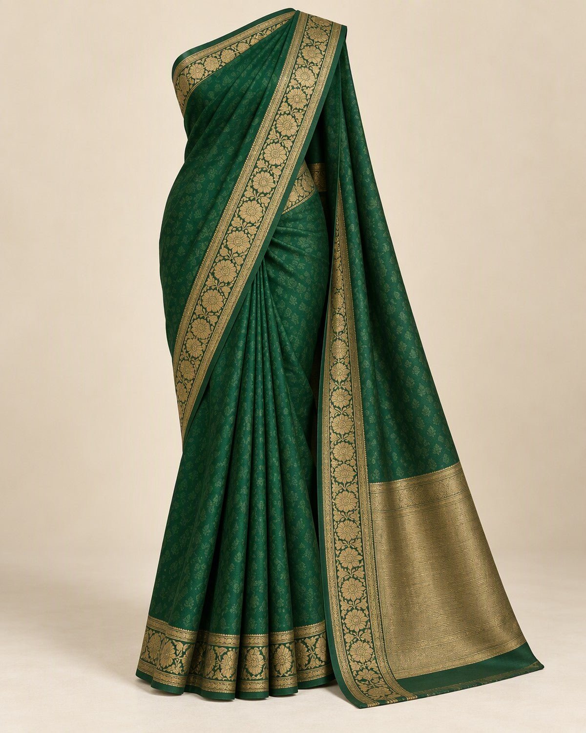 Emerald green saree with a broad antique gold border, front view